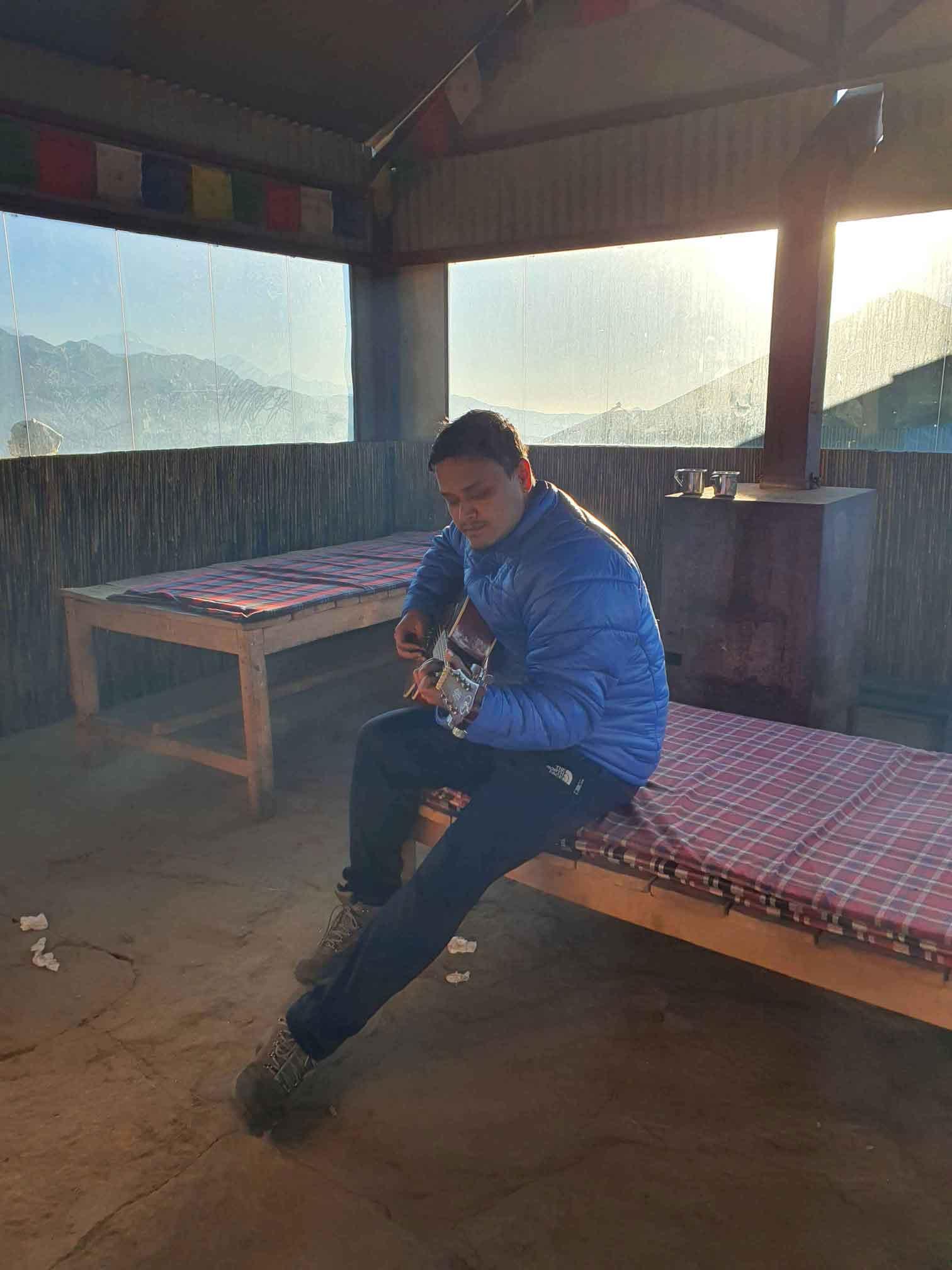 Me trying to get into the mountain vibe with a guitar in Khomai Danda.